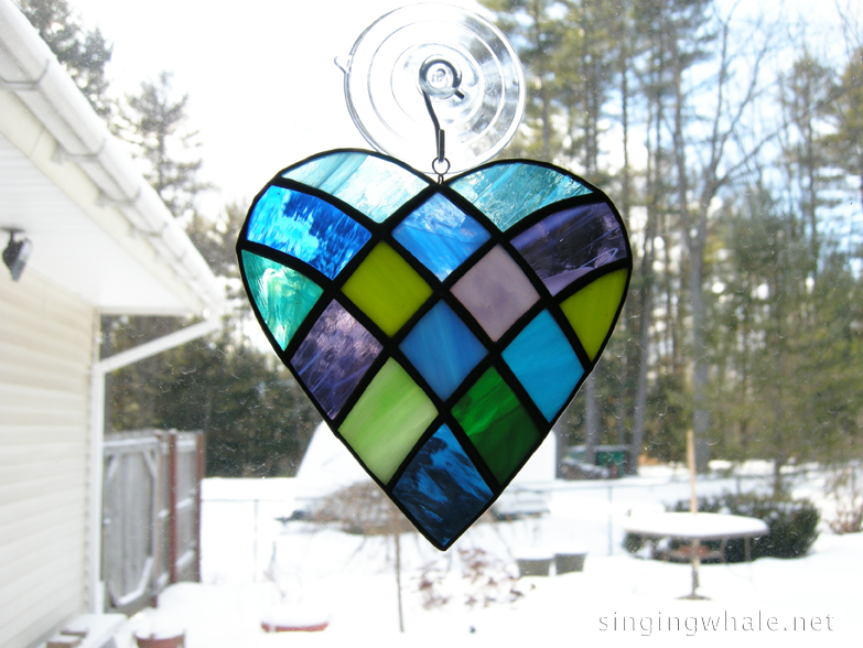 Patchwork heart made with all cool colors of glass.