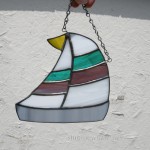 Stained glass sailboat with two stripe sail. $30 plus shipping.