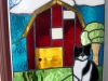 stained glass barn scene with cat